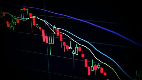 stock market candlestick chart on dark screen
